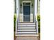 Stylish front entrance with decorative lighting and painted stairs at 41 Jane Jacobs St, Mount Pleasant, SC 29464