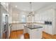 Bright, modern kitchen with stainless steel appliances, granite countertops, and a center island at 41 Jane Jacobs St, Mount Pleasant, SC 29464