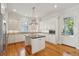 Modern kitchen with stainless steel appliances, an island, and custom cabinets at 41 Jane Jacobs St, Mount Pleasant, SC 29464