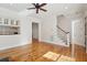 Open concept living area with hardwood flooring and access to stairs at 41 Jane Jacobs St, Mount Pleasant, SC 29464