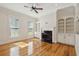 Bright living room featuring hardwood floors, a fireplace, and large windows at 41 Jane Jacobs St, Mount Pleasant, SC 29464