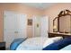 Comfortable bedroom features neutral walls, white closet doors, and an ensuite bathroom entrance at 411 Freeland Way, Moncks Corner, SC 29461