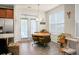 Bright dining area with a round table, chairs, and lots of natural light coming in through the windows at 411 Freeland Way, Moncks Corner, SC 29461