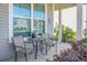 Cozy front porch with outdoor seating, offering a relaxing space to enjoy the neighborhood at 411 Freeland Way, Moncks Corner, SC 29461
