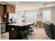 Bright kitchen featuring a large island with seating and stainless steel appliances in an open-concept layout at 411 Freeland Way, Moncks Corner, SC 29461