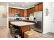 Modern kitchen featuring a granite island, stainless steel appliances, and plenty of counter space at 411 Freeland Way, Moncks Corner, SC 29461