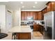 Modern kitchen with stainless steel appliances, granite countertops, and ample cabinet space for storage at 411 Freeland Way, Moncks Corner, SC 29461