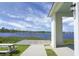 Stunning lake view from the community pavilion with picnic tables and a peaceful outdoor setting at 411 Freeland Way, Moncks Corner, SC 29461