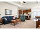 Inviting living room featuring a blue sofa and a recliner with neutral carpet and an open layout at 411 Freeland Way, Moncks Corner, SC 29461