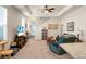 Spacious living room featuring a ceiling fan, an open layout, a television, and a staircase at 411 Freeland Way, Moncks Corner, SC 29461