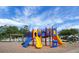 Brightly colored playground with multiple slides and swings near the community pool at 411 Freeland Way, Moncks Corner, SC 29461
