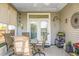 Covered porch area with seating and outdoor decor offers a relaxing outdoor space at 411 Freeland Way, Moncks Corner, SC 29461