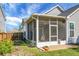 Enclosed back porch features large screens, offering an airy space with view of the backyard at 411 Freeland Way, Moncks Corner, SC 29461