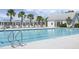 Sparkling community pool with lounge chairs and covered seating, perfect for relaxation and recreation at 411 Freeland Way, Moncks Corner, SC 29461