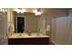 Bathroom featuring double sinks and a shower tub combo with a white curtain at 4210 Scharite St, Charleston, SC 29414