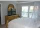 Inviting bedroom with a large bed, dresser, and window with bright natural light at 4210 Scharite St, Charleston, SC 29414