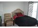 Cozy bedroom featuring a comfortable bed with a decorative headboard and a cozy reading chair at 4210 Scharite St, Charleston, SC 29414