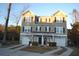 Charming townhome with symmetrical facade, individual garages, and inviting driveways at 4210 Scharite St, Charleston, SC 29414