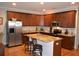 A spacious kitchen featuring granite countertops, stainless steel appliances, and a central island at 4210 Scharite St, Charleston, SC 29414