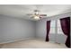 Neutral bedroom with a ceiling fan, two windows, and simple, modern finishes at 422 Temple Rd, Ladson, SC 29456