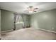Green bedroom offering neutral carpeting, a ceiling fan, and a window with natural light at 422 Temple Rd, Ladson, SC 29456