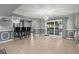 Open dining room with tile floors, chandelier, and sliding glass doors to the backyard at 422 Temple Rd, Ladson, SC 29456