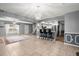 Open dining room with tile floors, modern chandelier and a view of the kitchen at 422 Temple Rd, Ladson, SC 29456