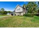 A charming exterior view of the two-story home showing the siding, brick accents, and well manicured lawn at 422 Temple Rd, Ladson, SC 29456