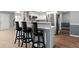 Kitchen breakfast bar with modern black stools and stainless steel appliances at 422 Temple Rd, Ladson, SC 29456