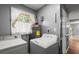 Laundry room with washer, dryer, and a window view to the outside at 422 Temple Rd, Ladson, SC 29456