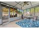 Cozy sunroom featuring tiled floors, a ceiling fan, a seating area, and natural light at 422 Temple Rd, Ladson, SC 29456