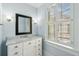 Stylish bathroom featuring a marble countertop, vanity with storage, and a window for natural light at 43 Montrose Rd, Mount Pleasant, SC 29464