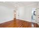 Spacious bedroom with beautiful hardwood floors and access to an ensuite bathroom for added convenience at 43 Montrose Rd, Mount Pleasant, SC 29464