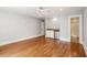 Spacious bedroom featuring hardwood floors, a ceiling fan, and a convenient wet bar area at 43 Montrose Rd, Mount Pleasant, SC 29464
