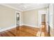 Bedroom with hardwood floors, neutral paint, and a doorway to a bathroom and another bedroom at 43 Montrose Rd, Mount Pleasant, SC 29464