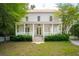 Charming two-story home with a spacious front porch and a well-manicured front yard at 43 Montrose Rd, Mount Pleasant, SC 29464