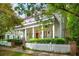 Elegant home exterior features a spacious porch with columns and a manicured front yard at 43 Montrose Rd, Mount Pleasant, SC 29464