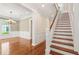 Welcoming foyer features hardwood floors, staircase, and archway leading to dining room at 43 Montrose Rd, Mount Pleasant, SC 29464