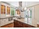 Spacious kitchen boasts granite island, custom cabinets, modern appliances, and outdoor views at 43 Montrose Rd, Mount Pleasant, SC 29464