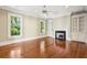 Living room boasts hardwood floors, a fireplace, and custom built-in shelves at 43 Montrose Rd, Mount Pleasant, SC 29464