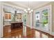 Living room featuring hardwood floors, a chandelier, and kitchen in the background at 43 Montrose Rd, Mount Pleasant, SC 29464