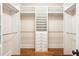Spacious walk-in closet with custom built-ins, shelving, and hanging rods for optimal organization and storage at 43 Montrose Rd, Mount Pleasant, SC 29464