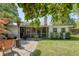 Landscaped backyard features a covered patio and lush green lawn, perfect for outdoor enjoyment at 45 Lyttleton Ave, Charleston, SC 29407