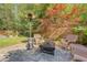 A cozy backyard features a patio with a fire pit and comfortable wicker seating at 45 Lyttleton Ave, Charleston, SC 29407