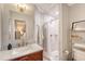 Stylish bathroom featuring a wooden vanity with marble countertop, walk-in shower, and neutral tones at 45 Lyttleton Ave, Charleston, SC 29407