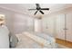 Bedroom with neutral decor, ceiling fan, and large closets at 45 Lyttleton Ave, Charleston, SC 29407