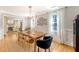 Bright dining area with hardwood floors, modern lighting, and adjacent kitchen at 45 Lyttleton Ave, Charleston, SC 29407