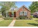 Charming brick home with a landscaped front yard and inviting porch at 45 Lyttleton Ave, Charleston, SC 29407