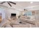 Spacious living room with fireplace, ceiling fans, neutral furniture, and a foosball table at 45 Lyttleton Ave, Charleston, SC 29407
