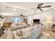 Spacious living room with fireplace, ceiling fans, neutral furniture, and a foosball table at 45 Lyttleton Ave, Charleston, SC 29407